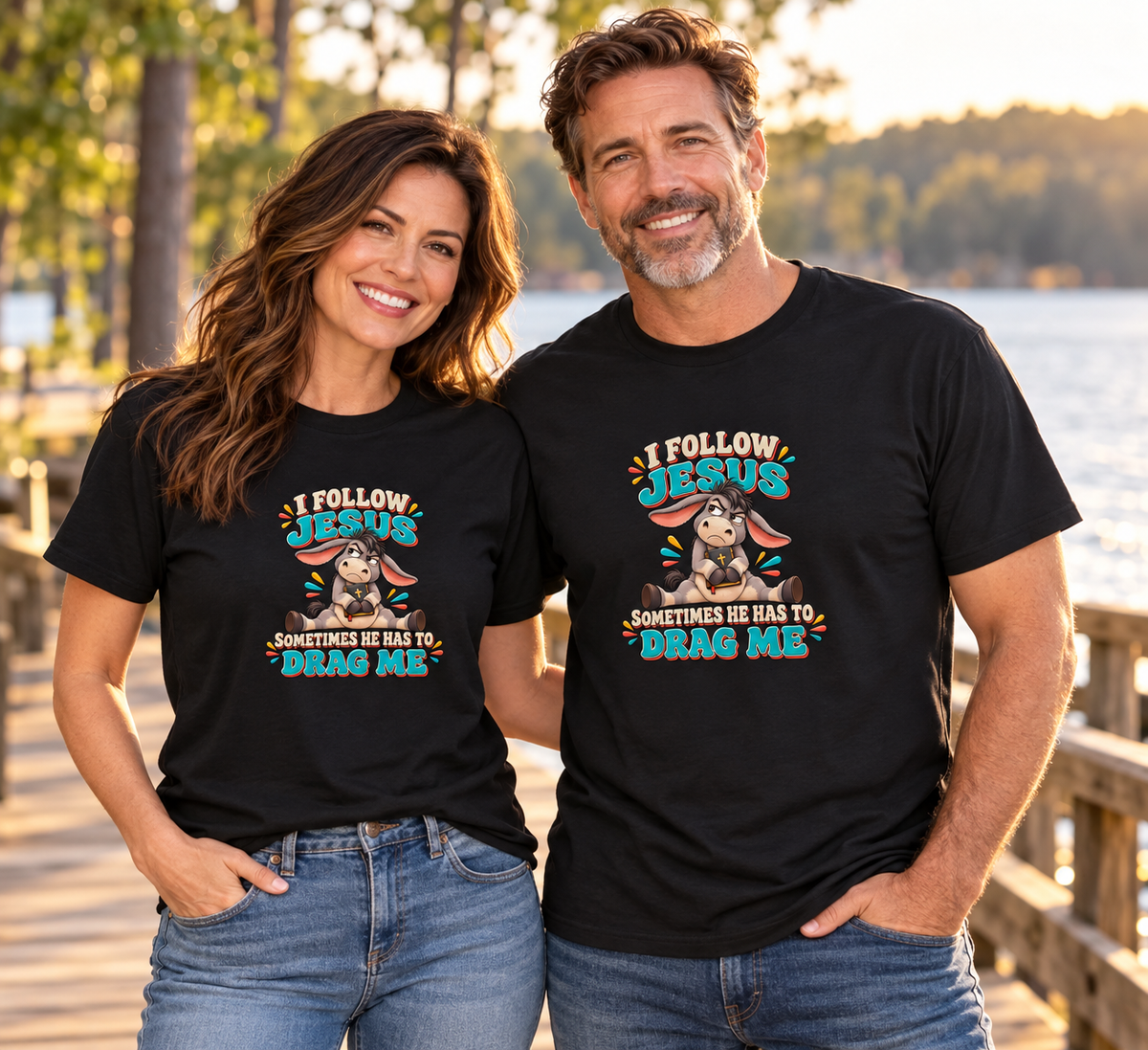 Models wearing the I Follow Jesus Sometimes He Has to Drag Me Donkey Unisex T-Shirt in an outdoor lifestyle setting